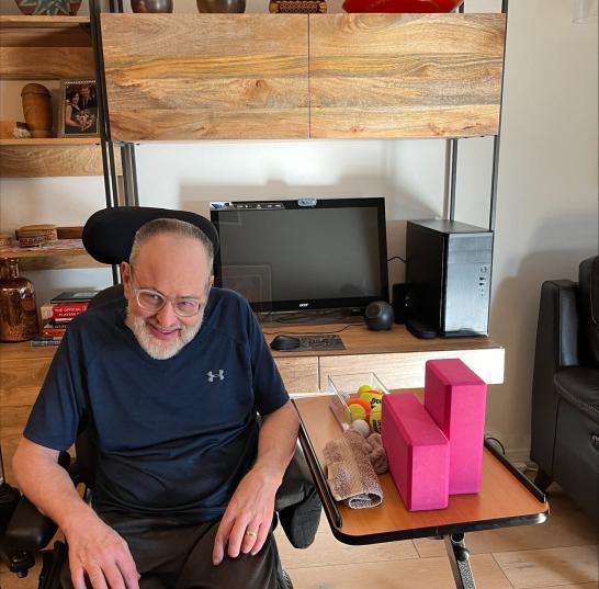 Gregg Mossberger in his home where he takes Zoom classes