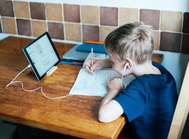 Young student using public wifi