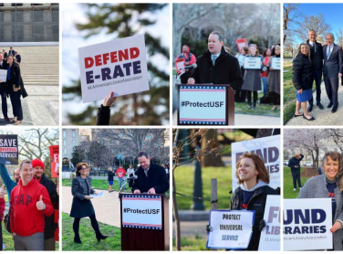 People marching with signs to defend E-Rate